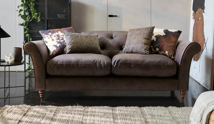 brown faux leather chesterfield sofa with patterns scatter cushions
