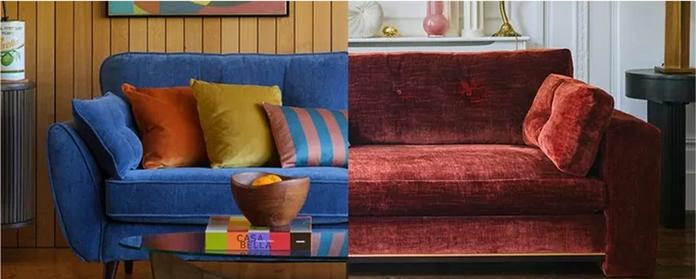 close up shot of a bright blue sofa with colourful scatters and a red sofa