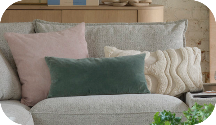 a selection of different coloured and fabric cushions