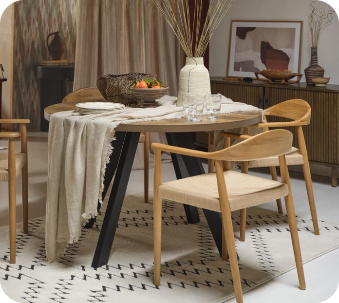 Wooden dining tables and chairs on a black and white patterned rug