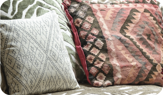 Patterned scatter cushions on a zebra print sofa