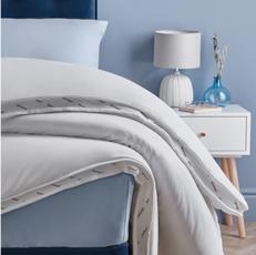 close up a duvet in a light blue room