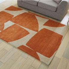 orange and cream patterned fluffy rug