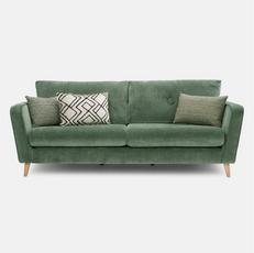 green mid century sofa with green and white pattern scatter cushions