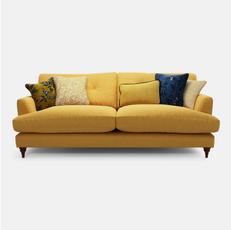yellow sofa with pattern scatter cushions