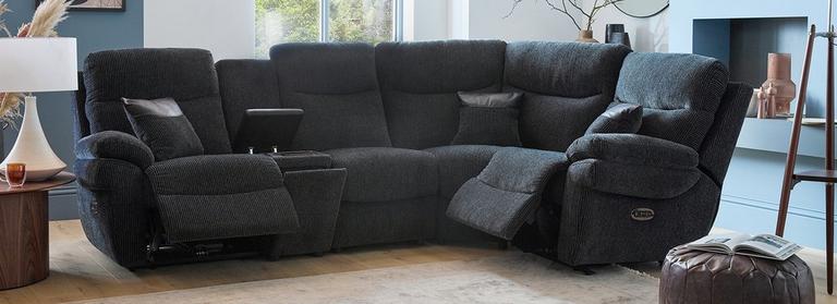 Black recliner sofa with hidden storage compartment in a cosy living room