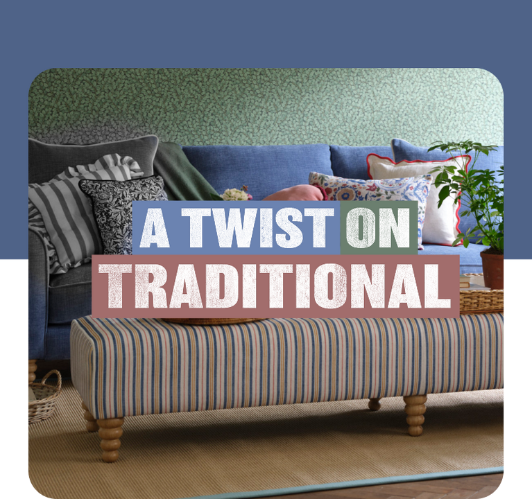 blue sofa against a green floral wall with a selection of patterned scatter cushions and next to a stripy footstool