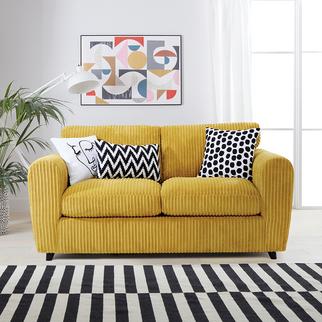 bright yellow jumbo cord sofa with monochrome scatter cushions