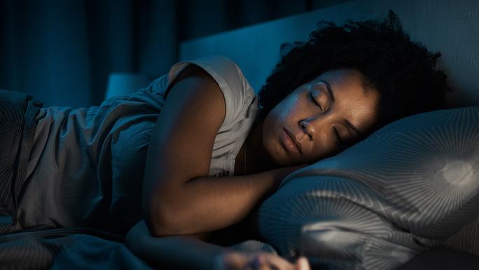 A women sleeping in a bed