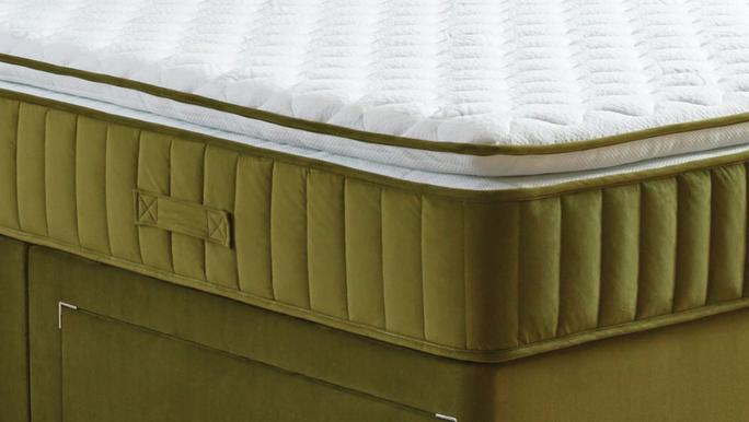 Close-up of a pocket spring pillowtop mattress with a velvet border and an extra layer of softness