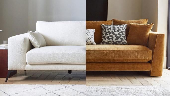 A white and brown sofa situated inside a bright living room