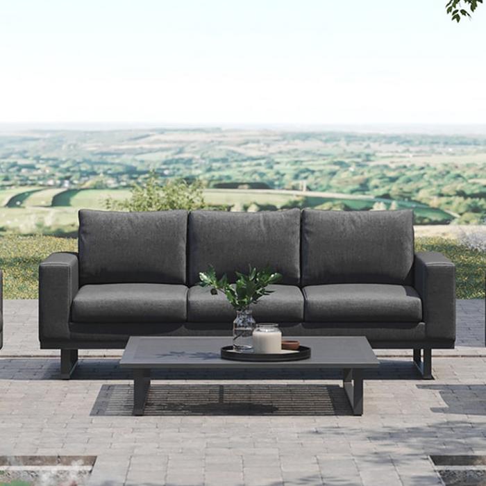 Black garden sofa with black metal legs and matching coffee table