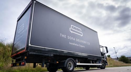 Sofa delivery company truck from the side