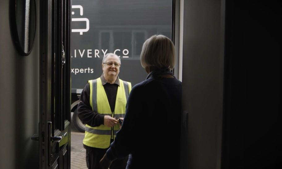 Delivery driver speaking to a customer