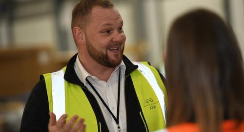 Man smiling in high vis vest